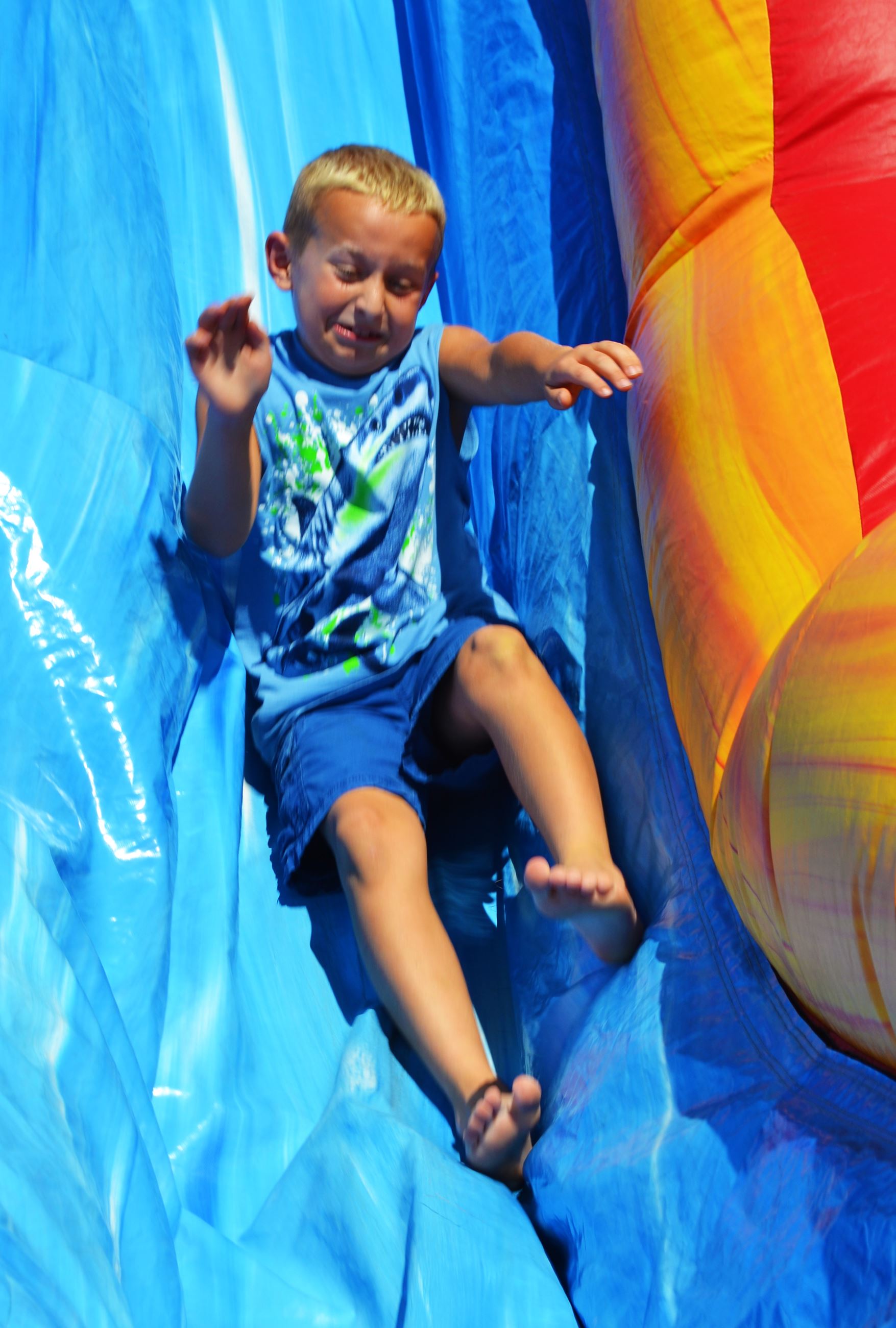 A child goes down a slide.