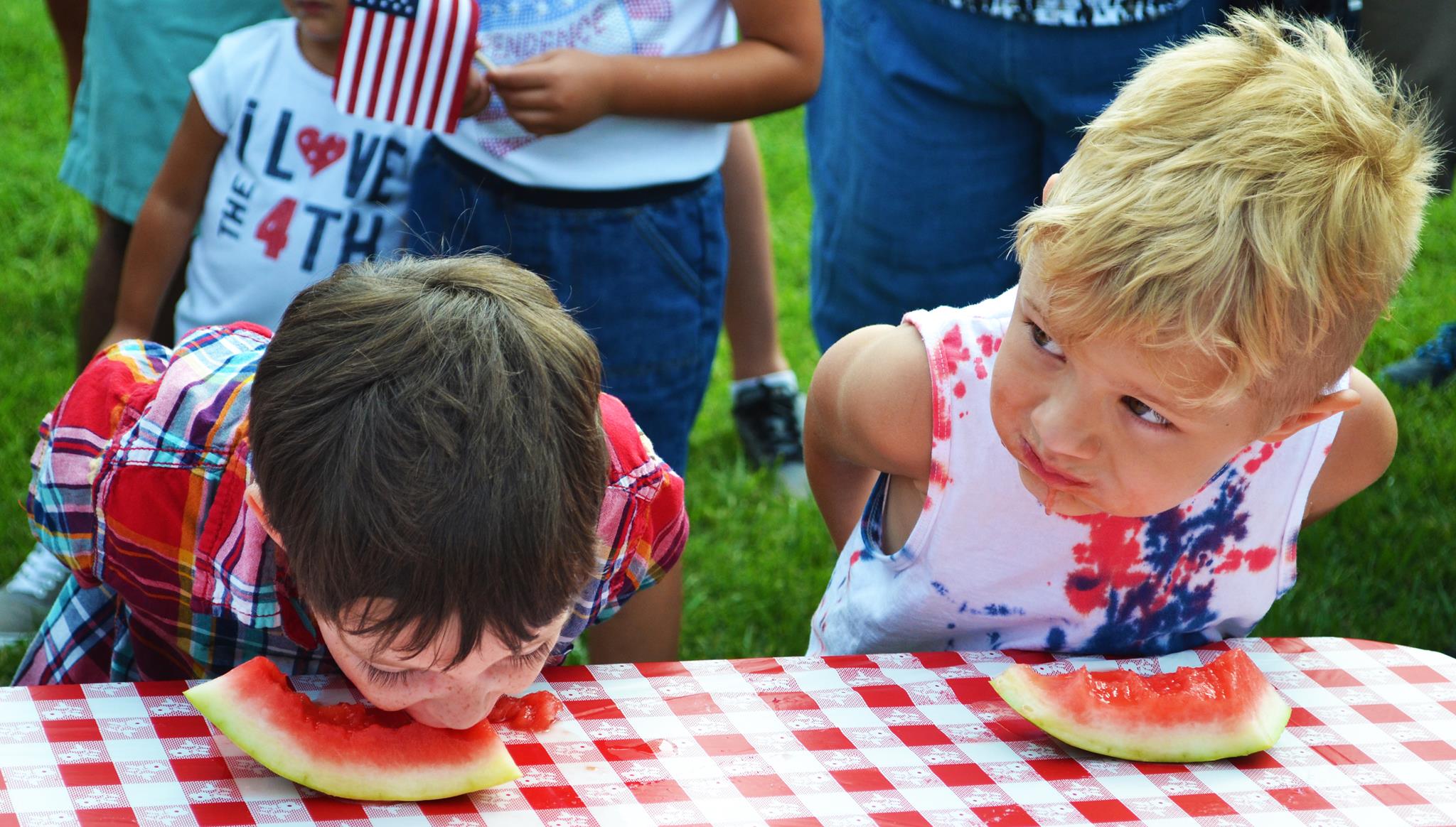Kids take part in the Watermelon Eating Competition