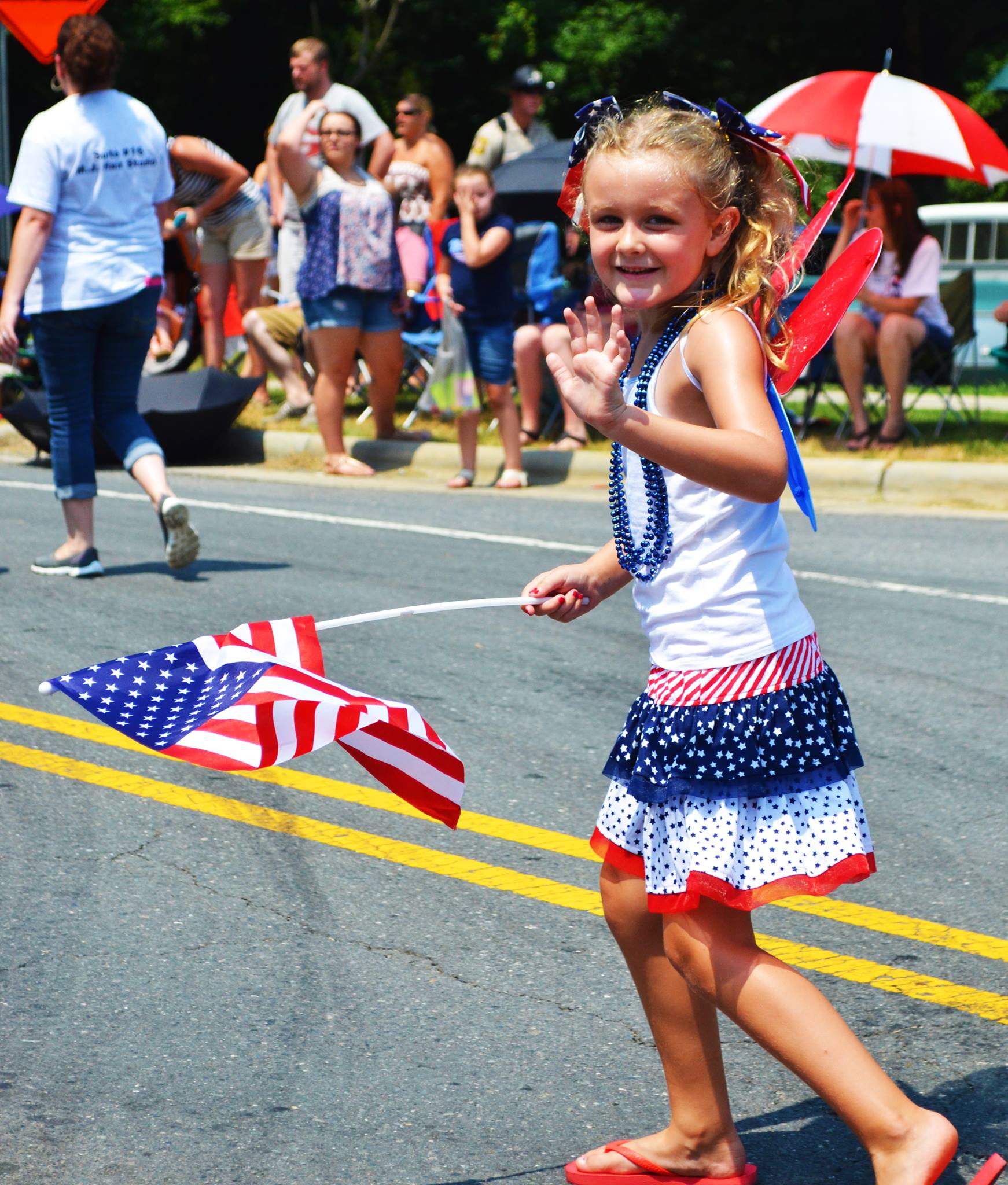 A girl walks by in the parade